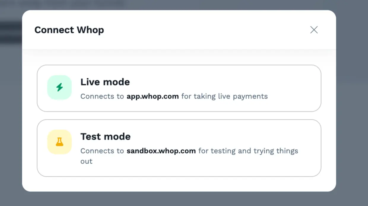 Connect Whop dialog offering a Live mode option for app.whop.com and a Test mode option for sandbox.whop.com.